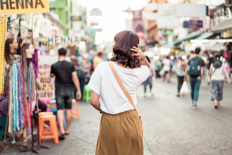 happy beautiful asian woman traveling khao sarn road thailand