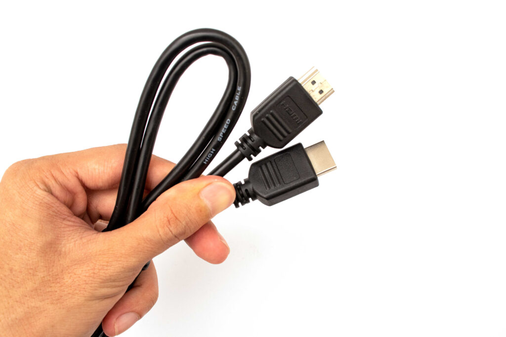 holding hdmi cable connector white background 1 1